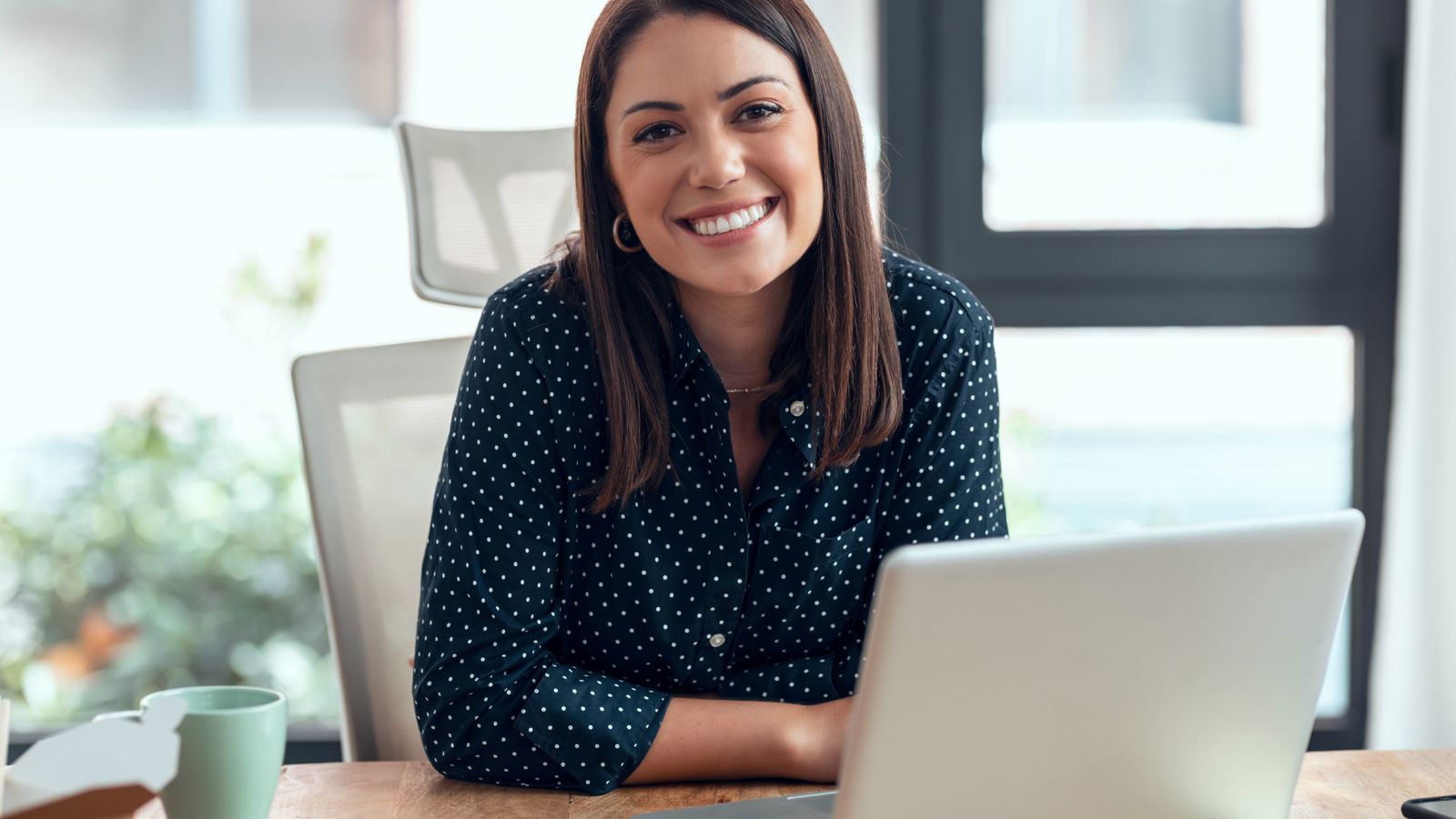Woman in front of computer in an office